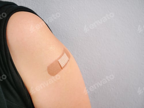 Preview: Close-up Medical Bandage on Arm After Vaccination