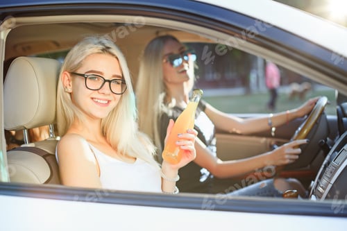Preview: Two Young Women Enjoying a Car Ride