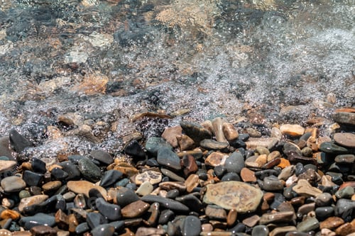 Preview: Little pebbles beach under water of the sea