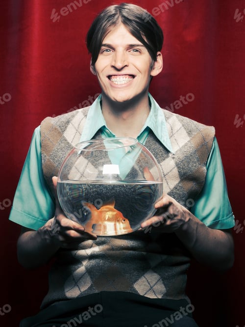 Preview: Smiling man holding fishbowl