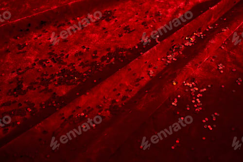 Preview: Abstract Christmas background made of red velvet fabric with red sparkles.