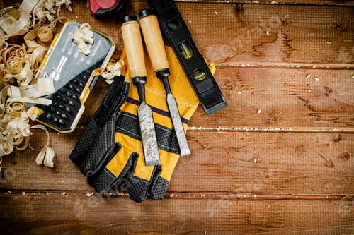 Preview: Chisels with wooden sawdust on the table.