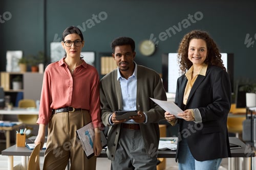 Preview: Multiethnic Young Adult Colleagues Collaborating in Modern Office Workspace