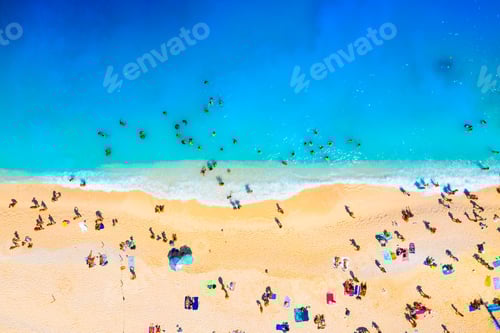 Preview: A drone view of the beach and the sea. People on vacation. Vacation and holidays.