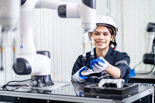 Preview: Female engineers working on robotics in industry factory. Technology, people and engineering concept
