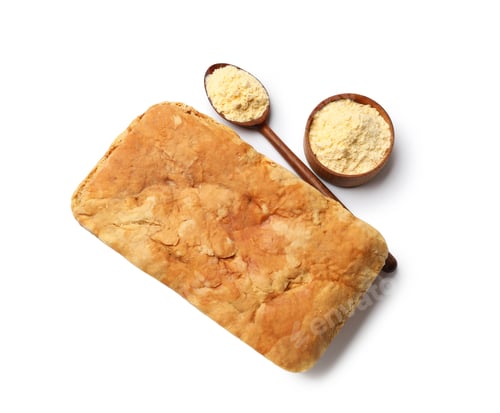Preview: Freshly baked cornbread loaf isolated on white, top view