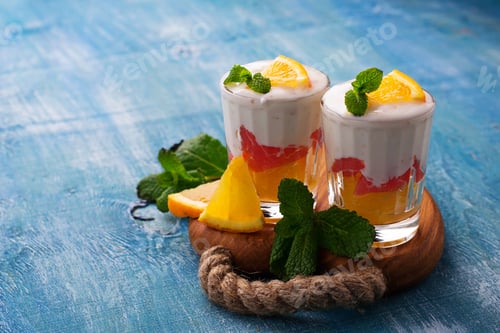 Preview: Dessert with cream, orange and mint