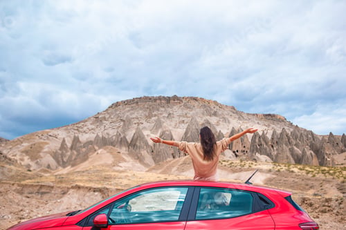 Preview: Happy woman on summer vacation in famous place. Cave formations