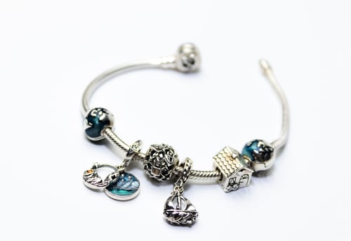 Preview: a picture of a bracelet that looks like it is made of silver with charms and
