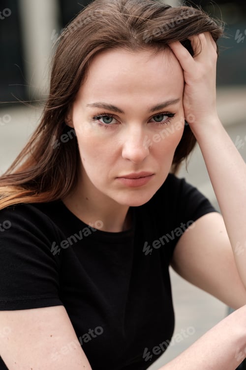 Preview: Portrait of serious caucasian woman looking at camera.