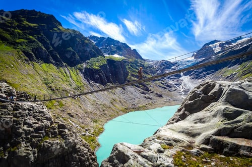 Preview: Tourist crossing Trift Bridge, Switzerland