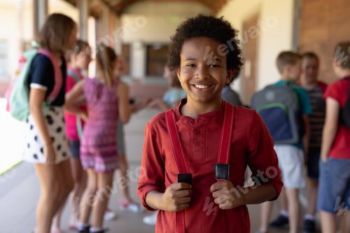 Preview: Schoolboy standing in the schoolyard at elementary school