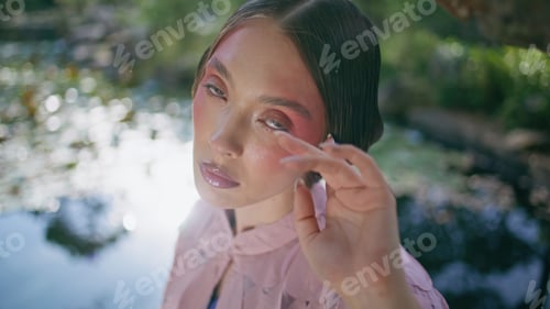 Preview: Elegant woman enjoy lake beauty in sunny forest close up. Model posing at pond
