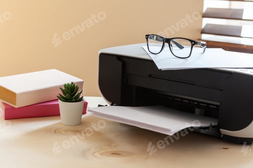 Preview: Close up of an office table with printer on it