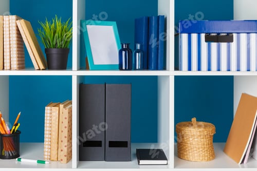 Preview: White office shelves with different stationery, close up