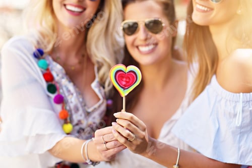 Preview: Happy girl friends hanging out in the city in summer
