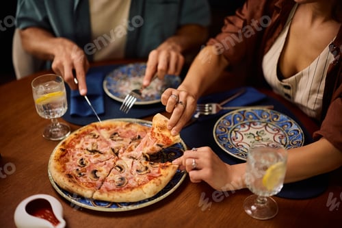 Preview: Close up of eating pizza in a restaurant.