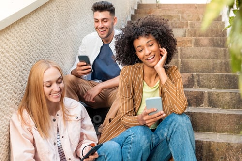 Preview: Diverse friends using smartphones on steps