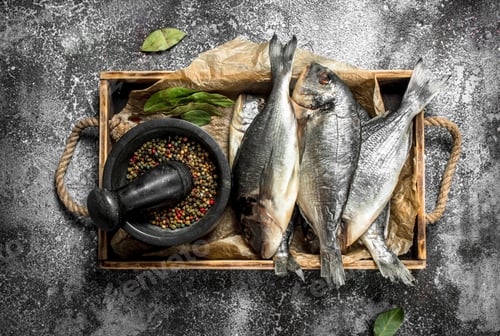 Preview: resh Dorado fish with spices on an old tray.