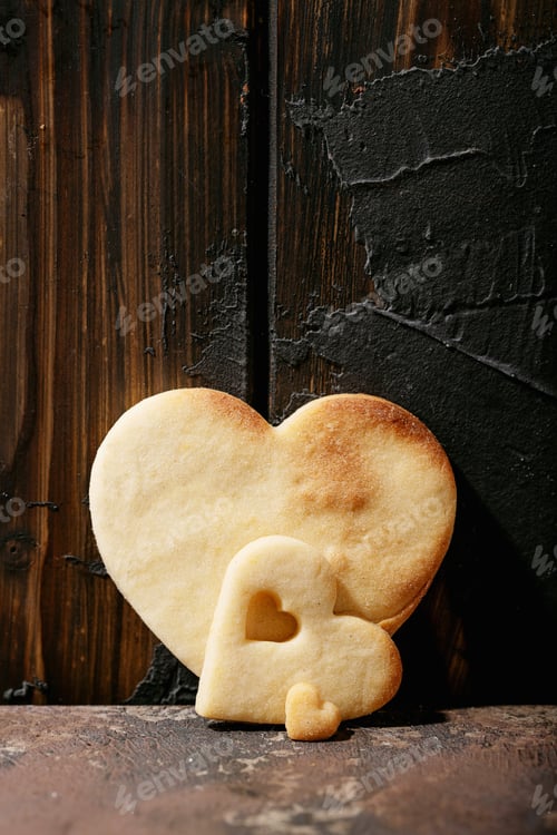Preview: Stacked Heart Cookies Against a Rustic Wood Backdrop