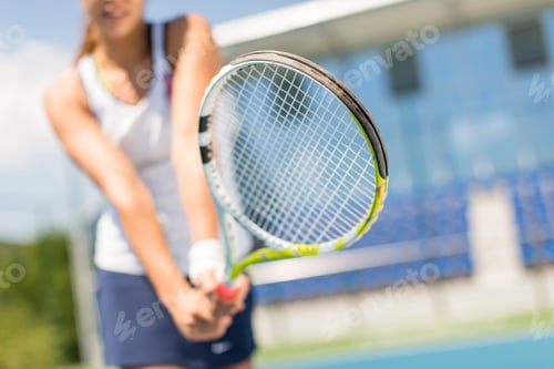 Preview: Young woman playing tennis