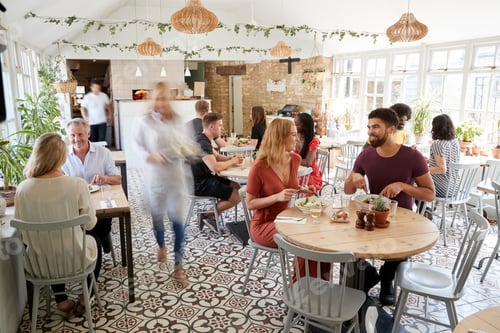 Preview: Lunchtime customers eating at a busy restaurant