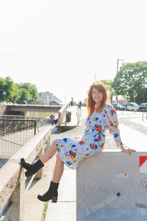 Preview: adult beautiful woman sitting outdoor