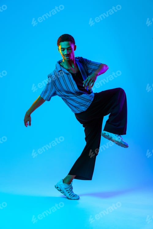 Preview: African man portrait in studio on colorful background