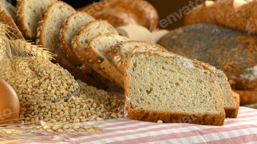 Preview: Sliced Grain Bread with Wheat Kernels on Table