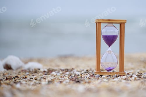 Preview: Hourglass at the beach on the ground