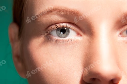 Preview: Beauty Closeup Eye Of Girl With Red Hair.