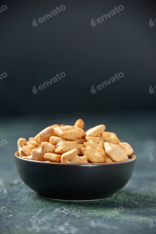 Preview: front view little salted crackers inside plate on dark background crisp color snack cips salt pepper