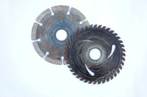 Preview: Closeup shot of old metal gears and round blades isolated on a white background
