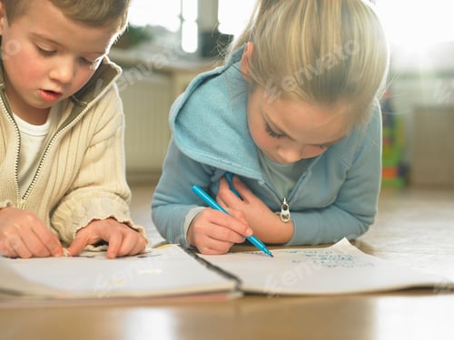 Preview: Children drawing together on floor