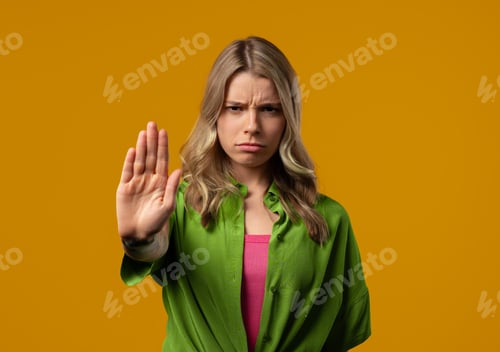 Preview: Uninterested woman disapproving with NO sign gesture. Denying, rejecting, enough