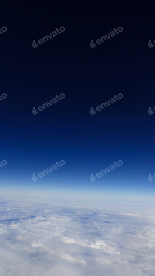 Preview: The beautiful cloudscape with clear blue sky. A view from airplane window.