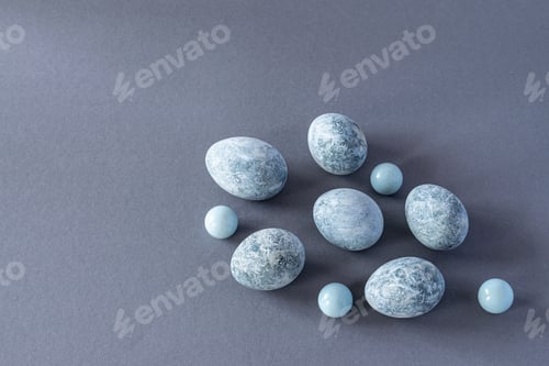 Preview: Marble Easter eggs on a gray linen napkin. Easter greeting card.