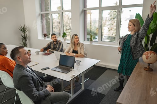 Preview: Engaged Female Presenter Addressing Colleagues During a Bright D