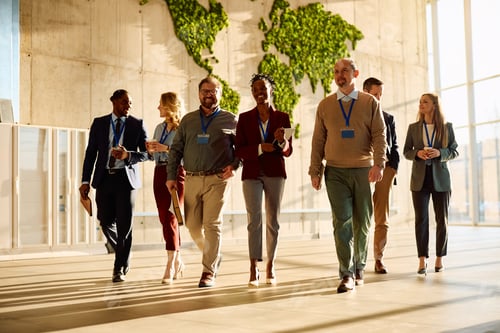 Preview: Multiracial group of happy entrepreneurs going on a business seminar.