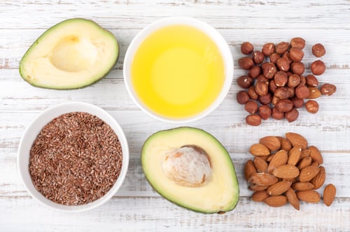 Preview: Foods with healthy fats. Sources of omega 3 - avocado, olive oil, nuts and flax seed on wooden