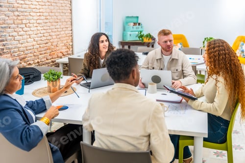Preview: Diverse startup team collaborating during an office meeting