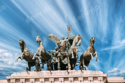 Preview: Rome, Italy. sculpture of horses pulling a chariot set against a beautiful blue sky