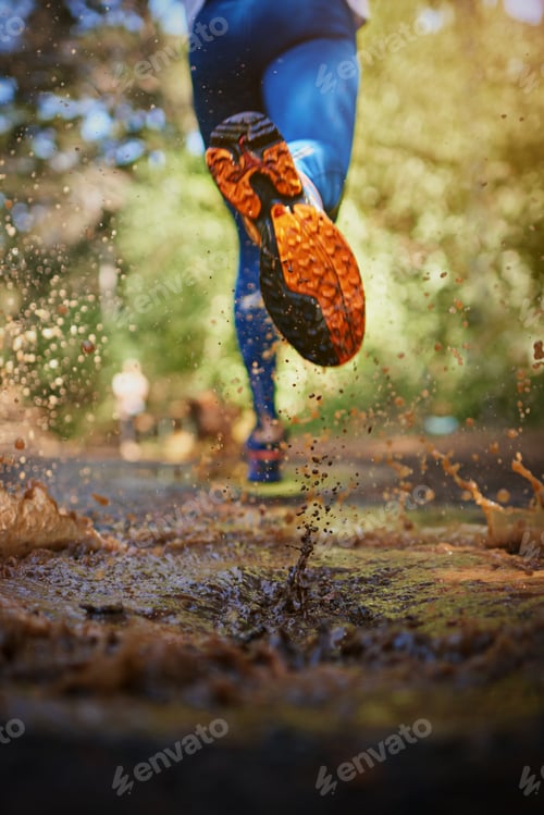 Preview: Running the roads less traveled. Cropped shot of a mans legs as hes running along a nature trail.