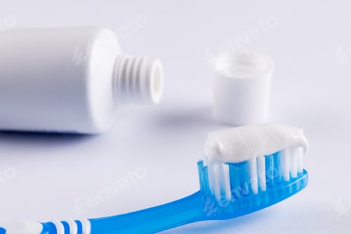 Preview: Image of toothbrush and toothpaste on white surface