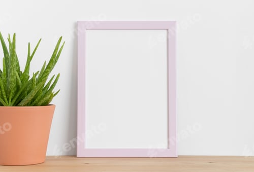 Preview: Pink frame mockup with a aloe vera in a ceramic pot on a wooden table. Portrait orientation.