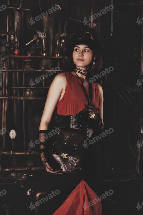 Preview: Stylish teen girl model in steampunk image in retro brown dress posing looking away