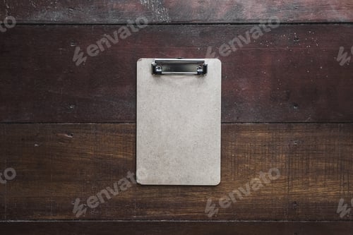 Preview: Vintage craft clipboard on dark brown wooden background. Empty space for text, sign or logo