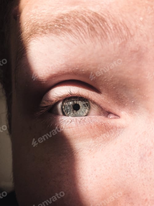 Preview: Closeup of a green eye of a man, human body part