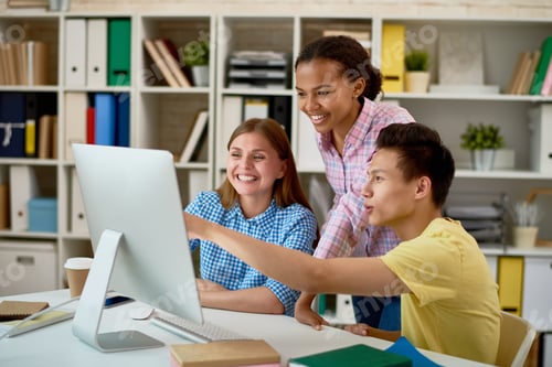 Preview: Smiling People Working with Computer