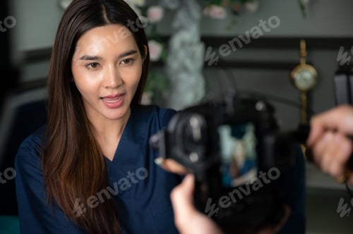 Preview: young Asian woman person are live video streaming broadcast technology at home